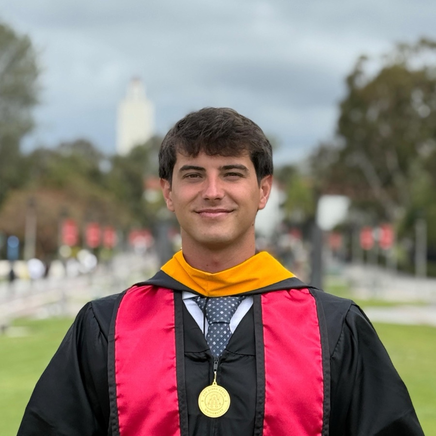 Miguel Bravo in graduation attire at San Diego State University